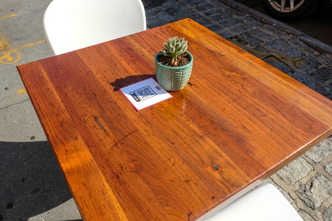 A QR code on the table serves as a menu